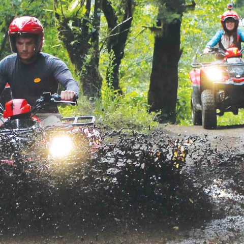 ATV riders mud splash