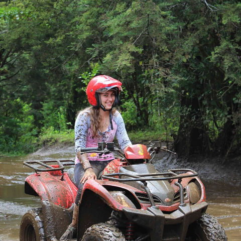 ATV Rider covered in mud